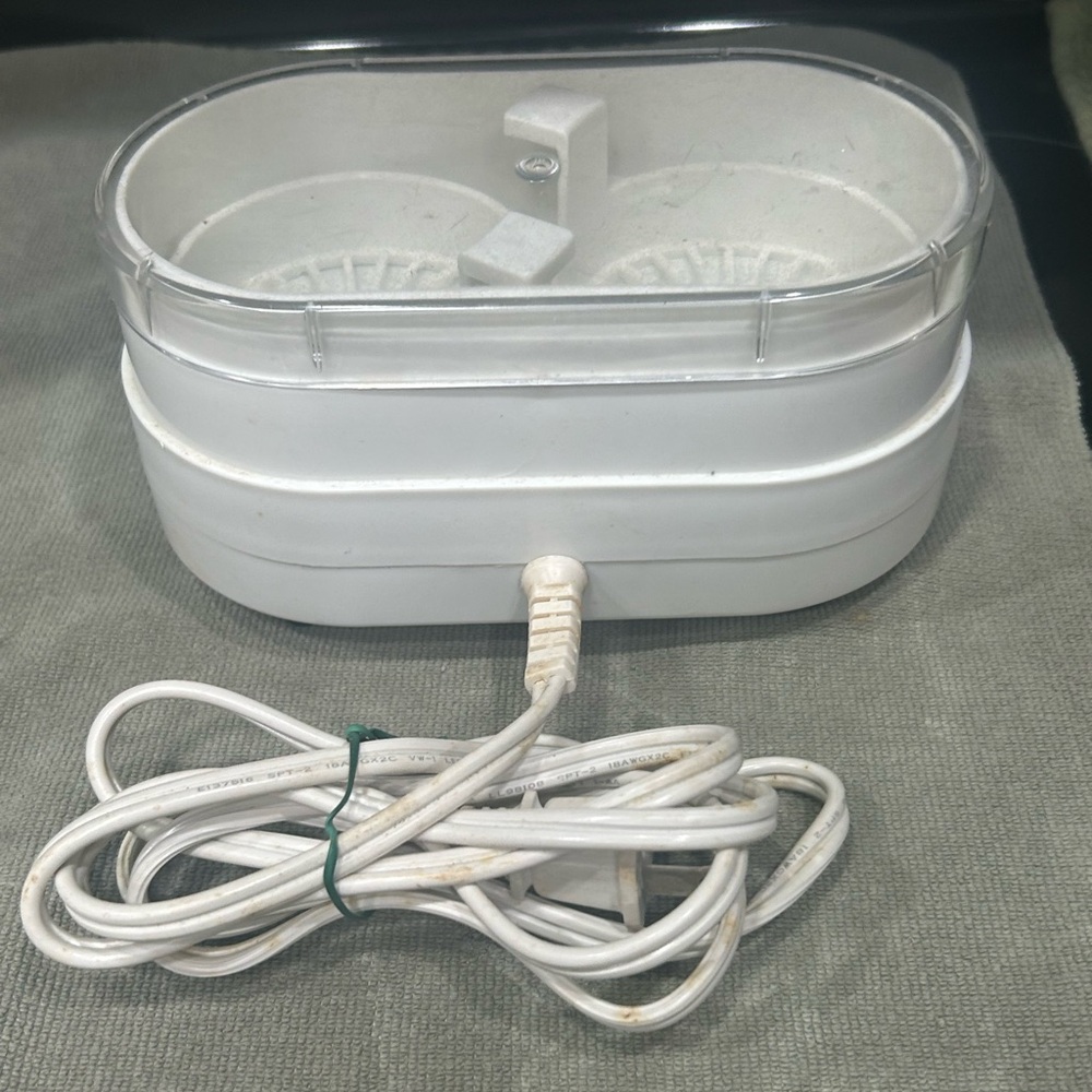 Compact White Electronic Device with Cable
